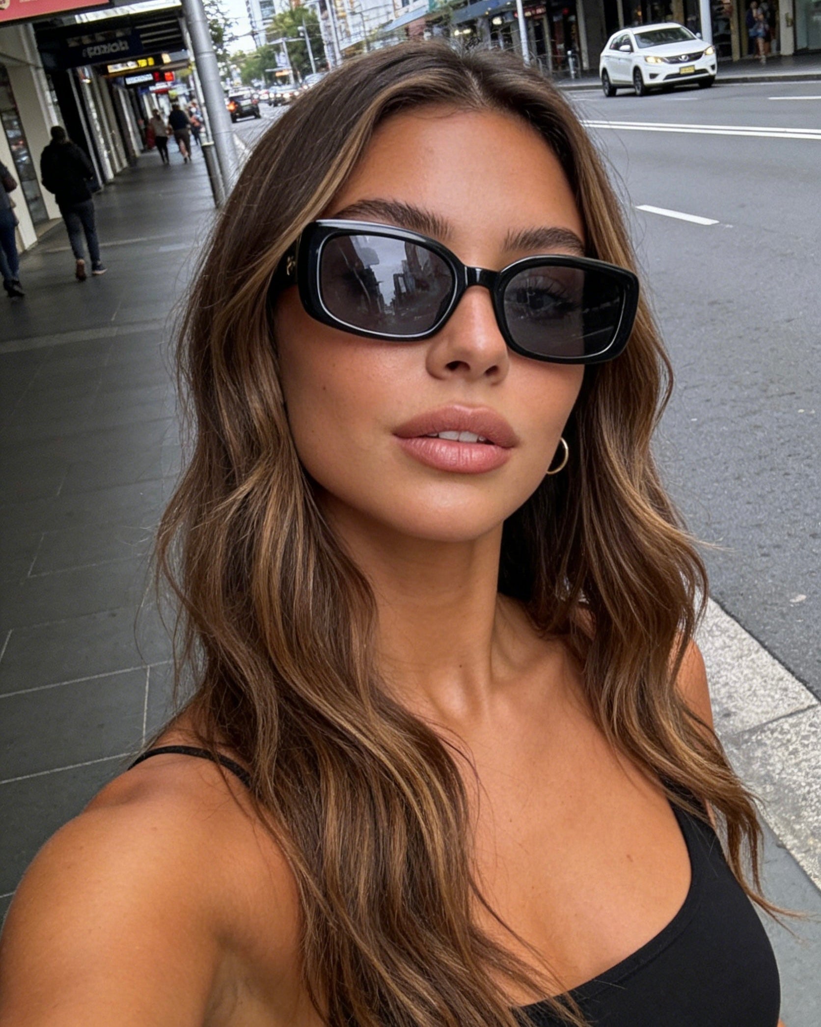 Classic black rectangle sunglasses with polarized lenses and UV protection, retro 90s inspired slim frame eyewear for women. Aesthetic chic everyday eyewear.