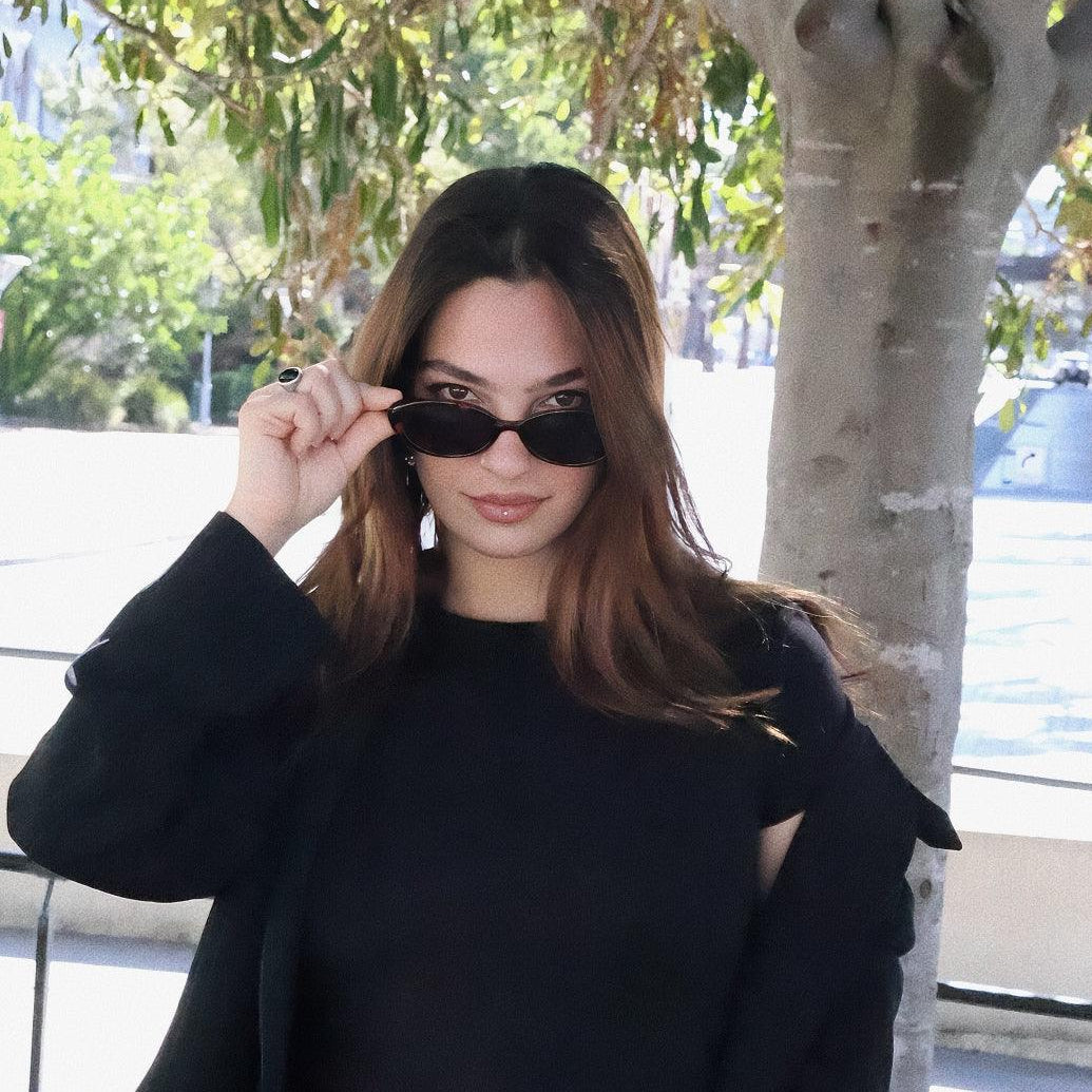 Playful and retro unisex oval sunglasses by By Charley, featuring a distinctive tortoiseshell frame and polarized lenses that offer 100% UV protection and glare reduction for a unique, fashion-forward look.