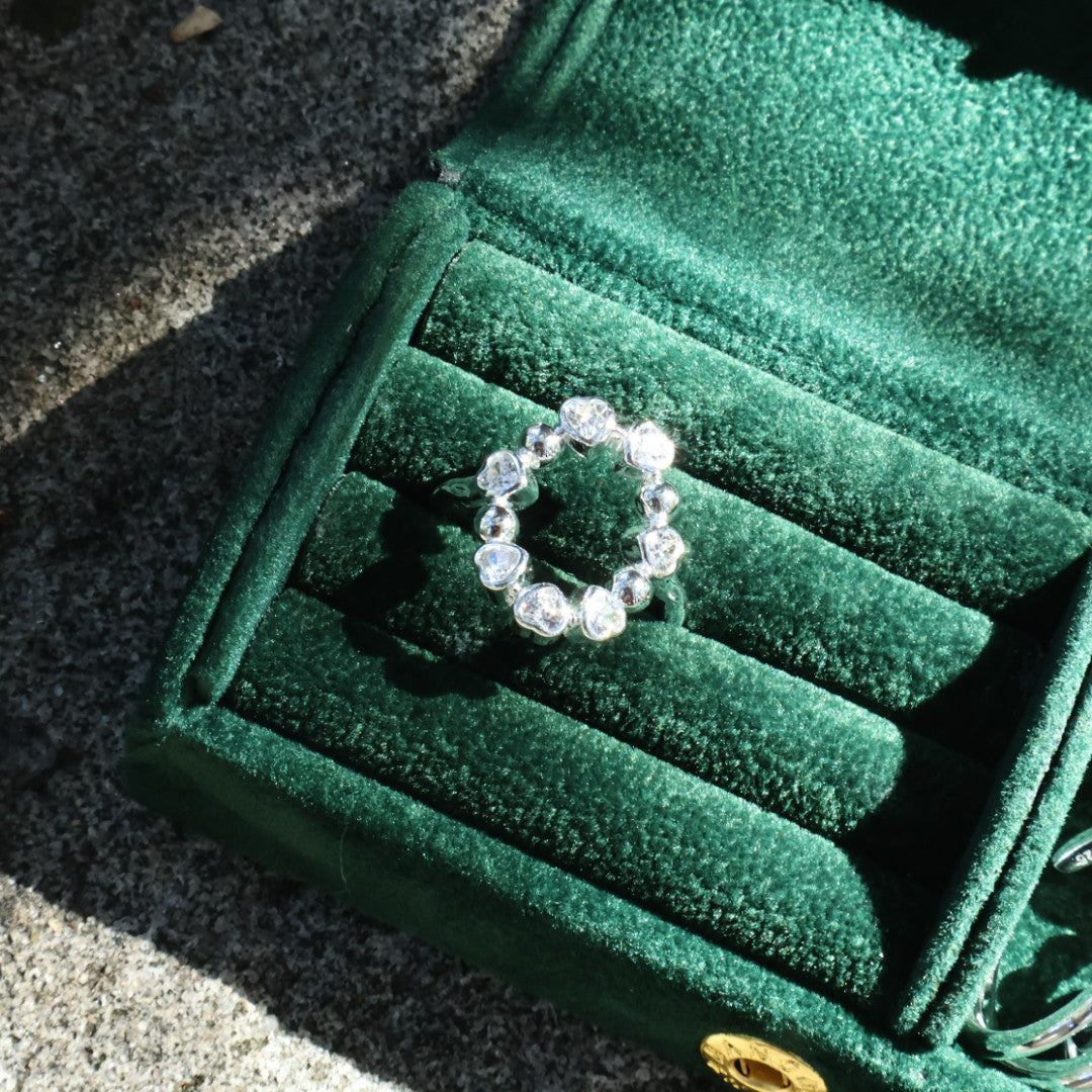 Close-up top view of the Maelie ring, highlighting the channel-set zircons and their soft, round-cut profile.