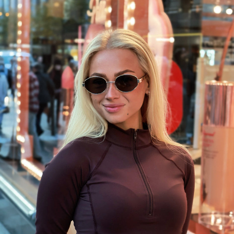 Classic unisex round sunglasses by By Charley, featuring polarized lenses that offer 100% UV protection and anti-glare functionality with a timeless vintage aesthetic.