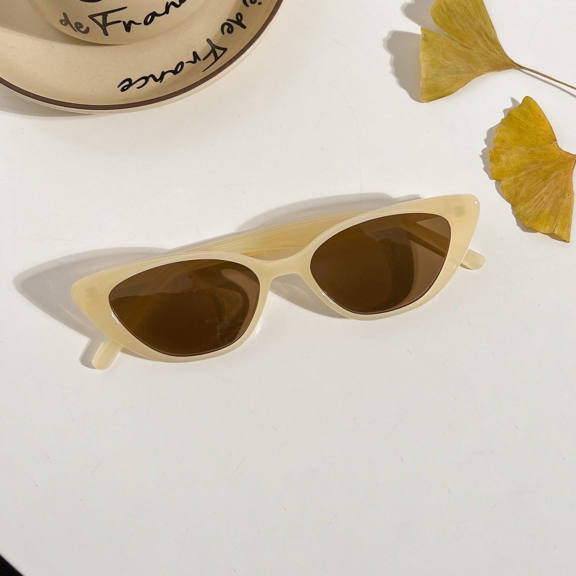 Playful unisex cat-eye sunglasses by By Charley, featuring a bold lemon frame and polarized lenses that offer 100% UV protection and glare reduction for a fun, retro-inspired statement.