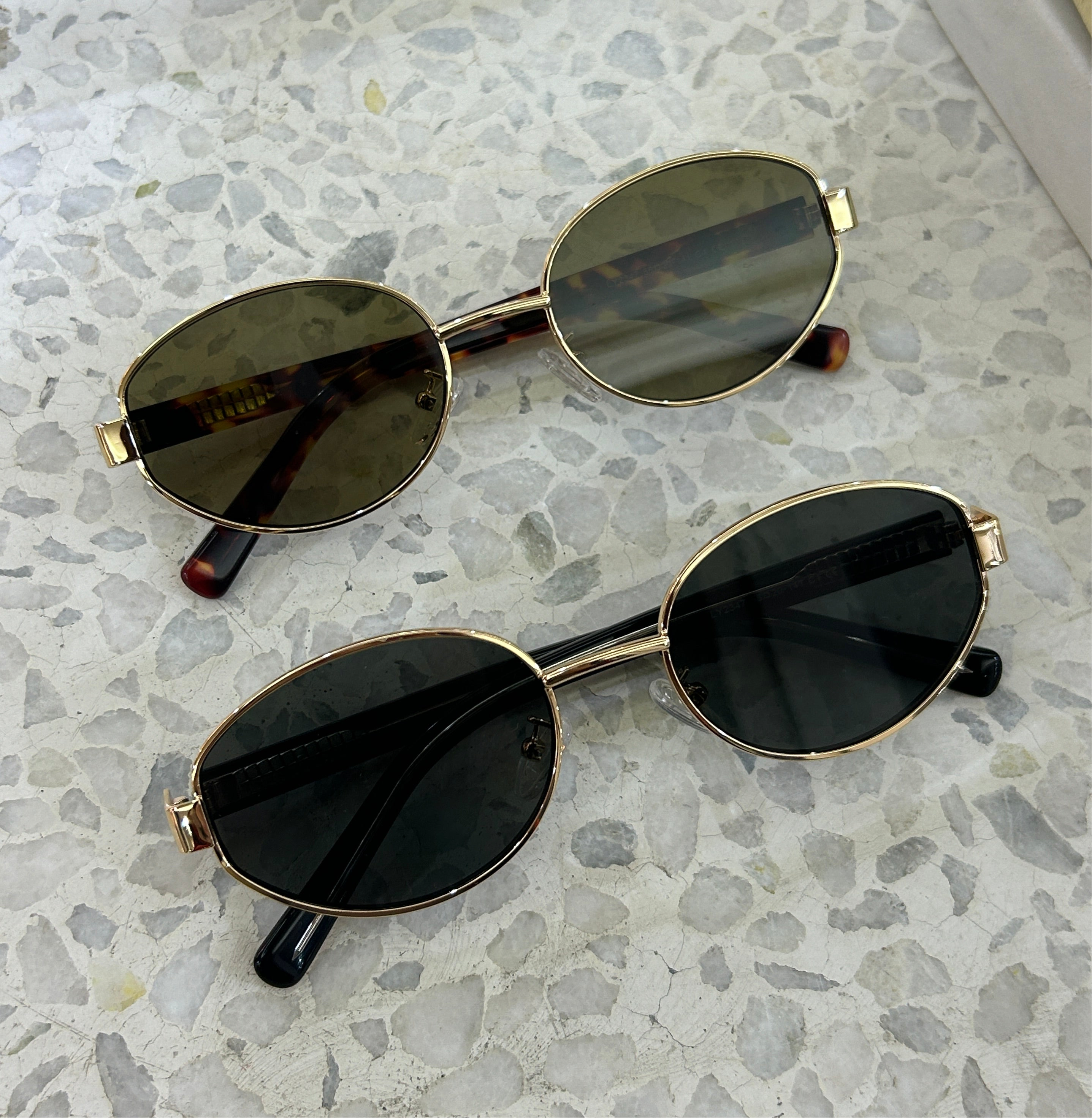 Classic unisex round sunglasses by By Charley, featuring polarized lenses that offer 100% UV protection and anti-glare functionality with a timeless vintage aesthetic.